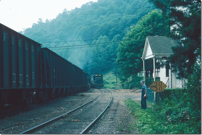 The Moss Turn heads into Dante Yard. The Elkhorn Turn waits to depart off the main line. 03-18-1977.