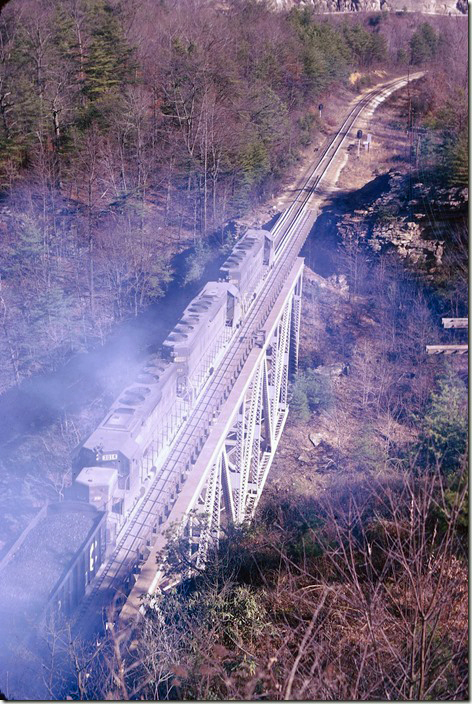 CRR 3014 trails a couple of SD45s on #26 leaving Elkhorn on 02-17-1974. Pool Point.