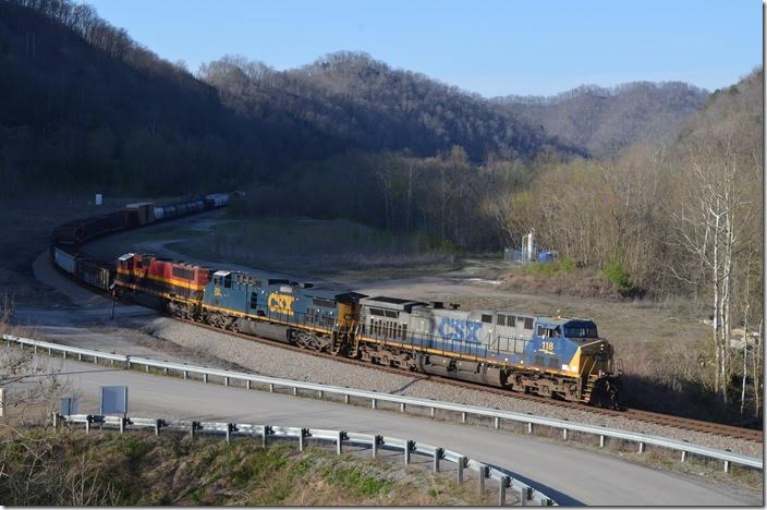 Just after getting home from work I heard a train blow. I’m not getting out of my recliner and away from my beer for anything less than a Kansas City Southern unit. Guess what! The third unit on Q693 this day was a KCS!! It was the first one I had ever seen on Big Sandy. CSX 118-201-KCS 3937. KCS 3937 is a SD70MACe converted by Progress Rail from a SD70MAC. FO Cabin.