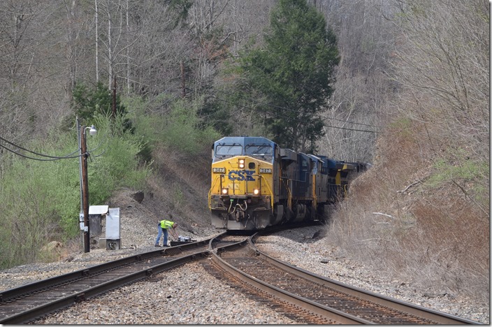 The conductor throws the switch. CSX 347-3162-3298-483. McClure VA.