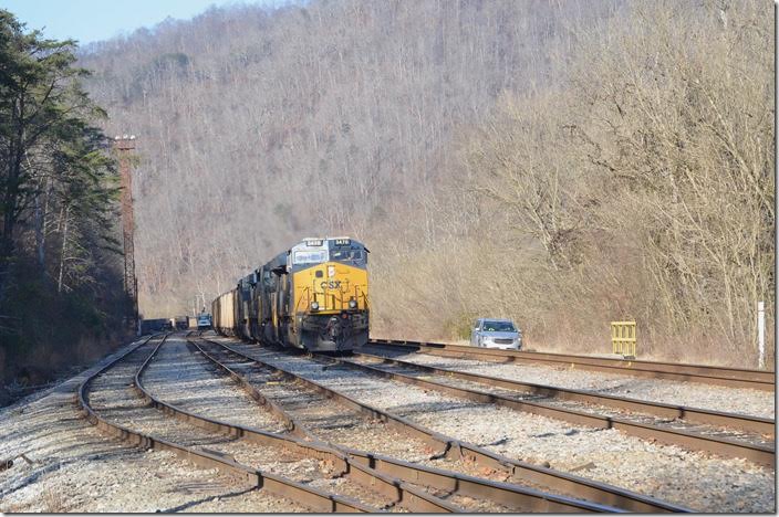 N760-14 comes to a stop at the east end of Shelby. MofW is working on yard track 2 in the distance. CSX 3470-980-561-426. Shelby.