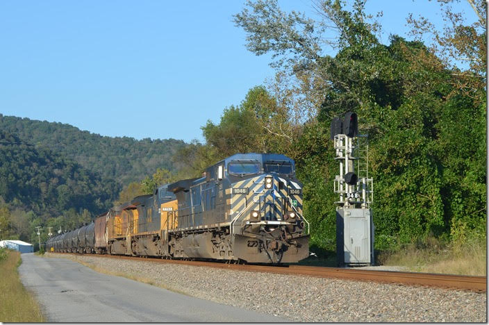 CEFX 1046-CSX 7765-UP 5442 on w/b empty ethanol train K446-05 with 96 tank cars plus 2 buffer cars. Boldman KY. 10-07-2018.