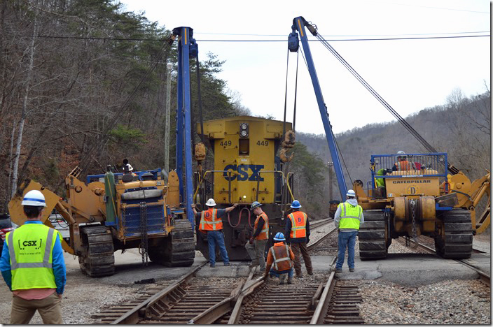 The side-booms trammed up the river side of the yard so as to not damaged the paved road. CSX 449 re-railing. Shelby KY.