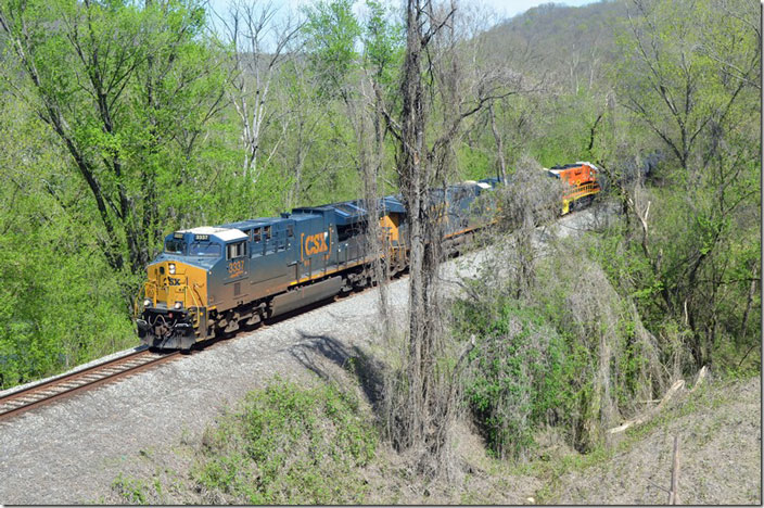 Q694-15 passes under the Town Branch bridge at Prestonsburg KY. CSX 3337-754-987-GC 2140. 04-17-2022.