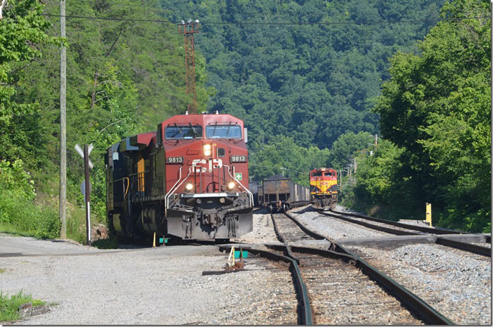 CP 9813-CSX 5201 pull out of the lead at the east end of Shelby with ethanol train B911-15 on 07-14-2022. That KCS on the main is the DPU on a westbound ethanol.