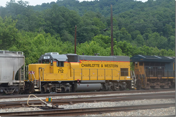 Charlotte Western Railroad (evidently its official name with no ampersand) is a subsidiary of Jaguar Transport Holdings. Jaguar acquired leasehold rights to this 13-mile short line which is owned by the North Carolina Dept. of Transportation. Charlotte Western connects with CSX (ex-SCL, nee SAL) at Mt. Holley and NS’s main line (ex-Sou.) at Gastonia. It was formerly SCL’s Gastonia Sub. (absorbed 1969) and before that the Piedmont & Northern Railway, an electric interurban. CER 712 GP15-1. Shelby.