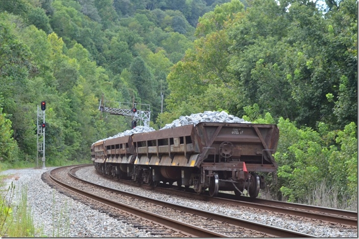 CSX 277. Rip-rap is still moving on Big Sandy. Some days a single car work train will be sent west to be dumped. There’s a bunch of side dumps and ballast cars at Shelby now. Often there are cuts of this stuff in the manifests. And random cars will not be dumped. I suspect they may have had a mechanical failure with the apparatus. FO Cabin KY. 09-09-2022.