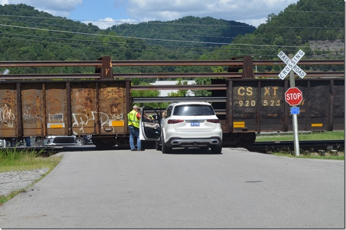 One of my neighbors (a doctor’s wife) ran into this slow moving rail train. Railroads don’t use “stop, look & listen” anymore, but she even failed to heed the non-standard “stop” sign that my neighbor attached. Nothing damaged except her SUV. This is the third such accident that I know of over the years. You’all have seen my various photos taken here. There’s plenty of sight distance. CSX 4550. WE Pauley. 08-12-2022.