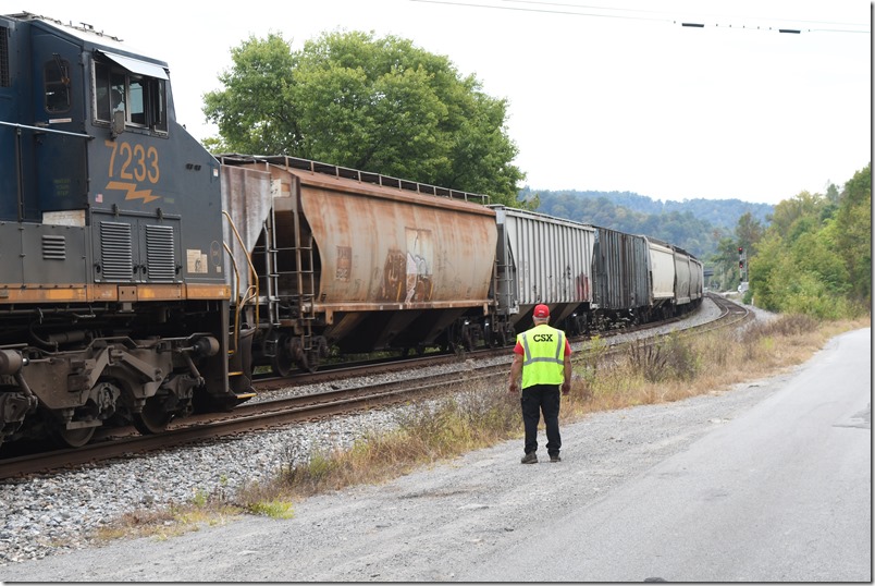 The conductor inspects M852. CSX 7233. Beaver Jct.