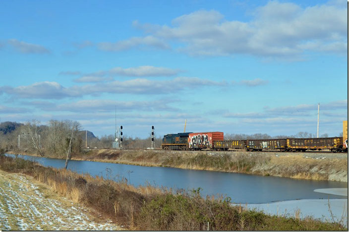 CSX 3358 heads a 190-car manifest Q303 (Russell to Cincinnati) by DG Cabin at Edington KY. 01-25-2022.