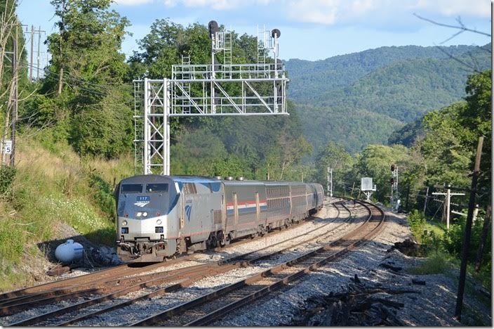 Amtrak 51 behind 117 with 7 cars rips by at 6:40 PM running about 20 min. late leaving Hinton. Amtrak 117 Meadow Creek.