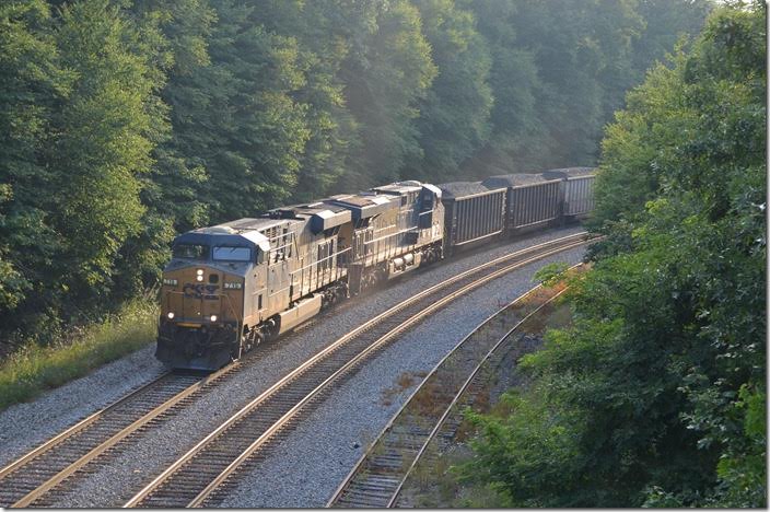 T051 picked up speed east of Terra Alta to make a run at the 5-mile Deer Park grade (1.04%). I ran ahead to Altamont expecting him to get there sooner than he did. With 77 loads and no pusher, T051 was really grinding when he came under the Route 135 bridge. The bridge is being replaced, but there is a good detour via Swanton. CSX 719-720. Altamont MD.