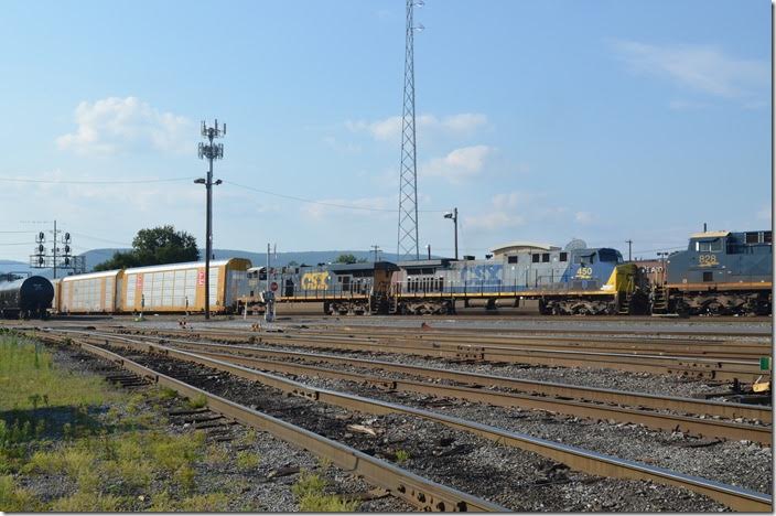 CSX 450-5201 pull into the yard for a crew change at Virginia Avenue with eastbound multi-levels and single stacks. Cumberland MD.