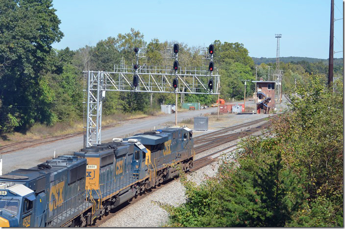 Finally the w/b freight parked under the bridge gets a yard crew to drag it into the yard. The bottom lunar light indicates restricting into the yard. CSX 5473-8804-4534-906-3256. Mexico MD.