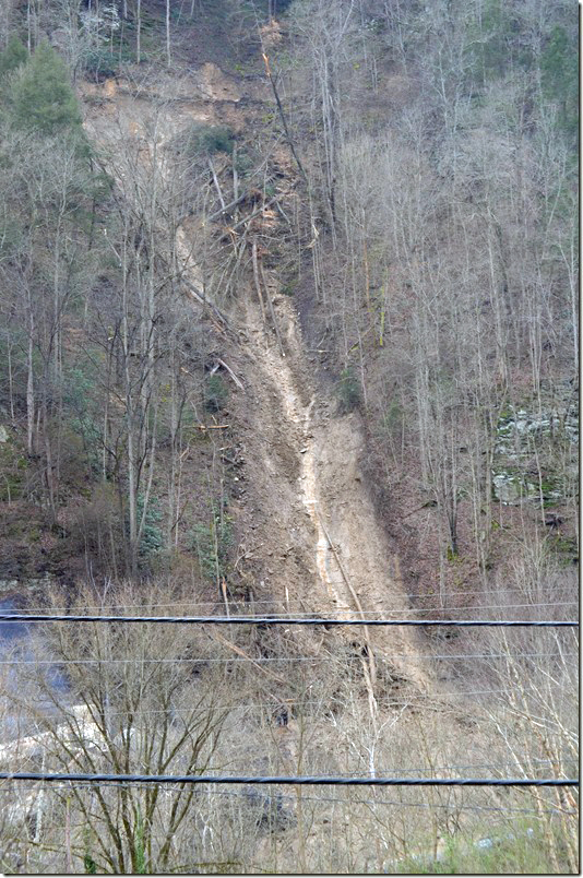 One tank car was pushed into the edge of the river and almost completely covered.