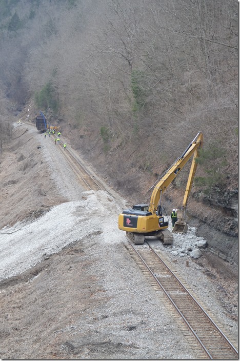 Moving the FPEX wood chip hopper that had been the buffer car behind the engines. (In the distance). CSX derailment. Draffin KY.