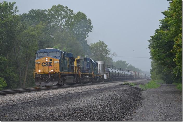 Thunder crashes! Lightning flashes! Herb and I jump out in the deluge to get CSX 5413-359-2788 plowing east with 115 cars of Q401-28 (Cumberland-Hamlet NC). Clear signal. CSX 5413-359-2788. Green Spring WV.