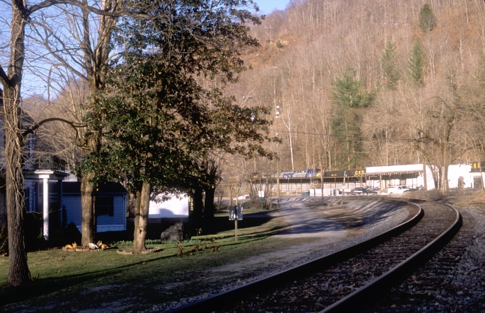 The former community of High Splint is now coal company property.  They have a security guard near the bridge.  The white house contains the High Splint Museum, but admission requires the guard to call a local resident to open it.  I cautiously walked across the bridge to get this shot of 14-777 shoving up the steep Seagraves Creek Branch where the mine is located. 