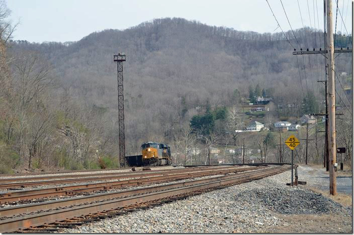 CSX 3196-3124, a westbound with 71 empties, rounds the curve in Avis Yard not far from the Hinton depot. Avis WV.