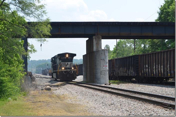 A Huntington Turn or Q302 heads east with a bunch of engines for the Huntington Loco. Shop. NS 9119 waits on the river lead to cross over CSX at KV Cabin. Kenova. 05-11-2015.