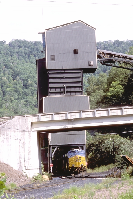 After coming back down the siding, C640 sets over one empty hopper.