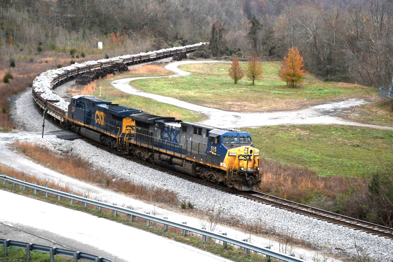 CSX 515-7566 approach FO Cabin between Pikeville and Fords Branch on 12-02-2024. Eastbound W094 has 55 air dumps of rip-rap stone to be used to repair flood damage south of Erwin TN.
