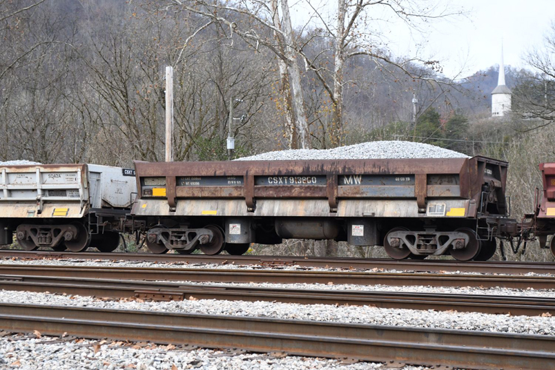 CSX 913800 has a load limit of 150,800 and 40 cubic yards. DIFCO built it in 08-1969. My 1974 Car And Locomotive Cyclopedia shows B&O AD91. That car is described as 150,000 "77 ton" and with 40 cubic yard capacity. AD91 was built in 1971, so 913800 could very well be ex C&O/B&O. DIFCO offered air dump cars with 40, 50 and 60 cubic yard capacities. DIFCO says they could raise to 50 degrees and dump to either side in 8 seconds!