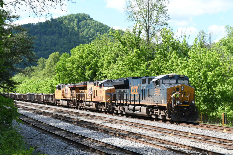 CSX 3357 leads UP 2642-5483 about to depart Shelby yard on 05-06-2025. W090-03 has 71 cars of rip-rap weighing 9,408 tons.