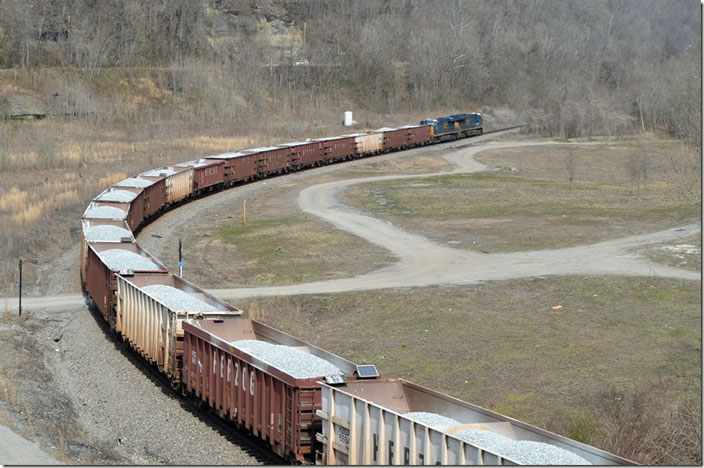 CSX 3303-3230 head west with ballast train W081 to dump at various locations between Wagner and Prestonsburg. FO Cabin. 03-09-2021