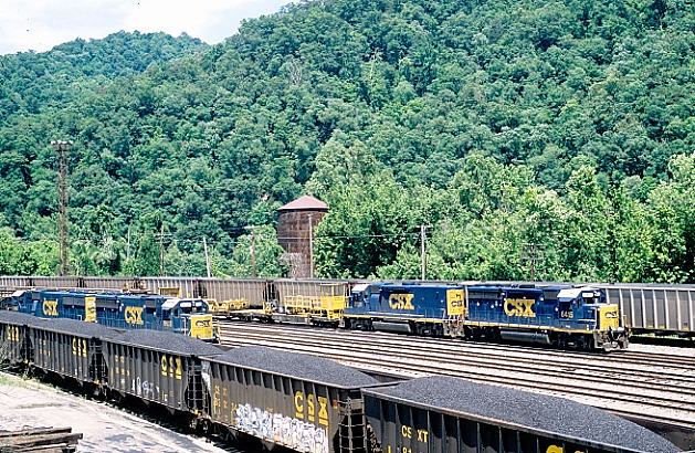 An eastbound rail train arrives Shelby behind 6415-2231.