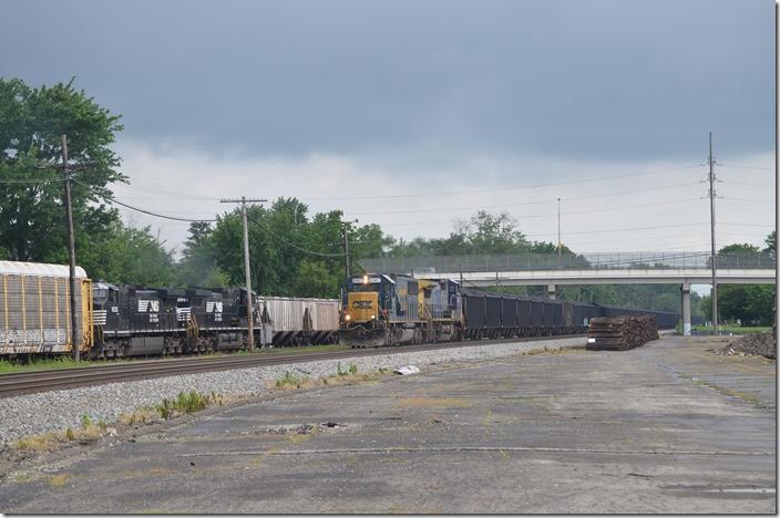 NS 8987 rolls east with a loaded multi-level train of autos, as CSX 8567 approaches. Marion.