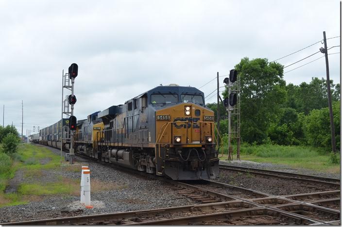 CSX 5458-42-931 on e/b intermodal train Q008 on the Indianapolis Line SD (ex-NYC) bangs across the Columbus SD (ex-C&O). There was a large contingent of UPS piggybacks on this train. Marion OH.
