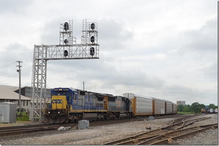 CSX 7627-8593 on e/b loaded multi-level train Q254. The former Erie-Lackawanna yard is on the right. Marion OH.