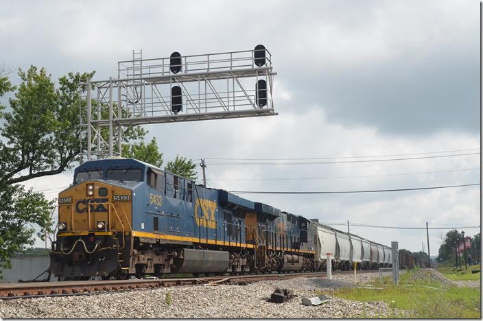 Coming down grade from Altamont Q317 was really rolling through Mountain Lake Park. After working West Keyser he had 64 cars. CSX 5433-3072. Mountain Lake Park MD.