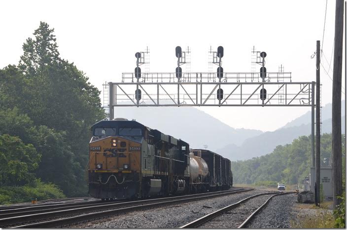 Q317 stops at the location of B&O Z Tower. The huge yard is mostly gone, but 5433-3072 make their set-off and pick up on a controlled siding. Most of this traffic would be for the nearby paper mill at Luke. CSX 5433-3072. West Keyser WV.