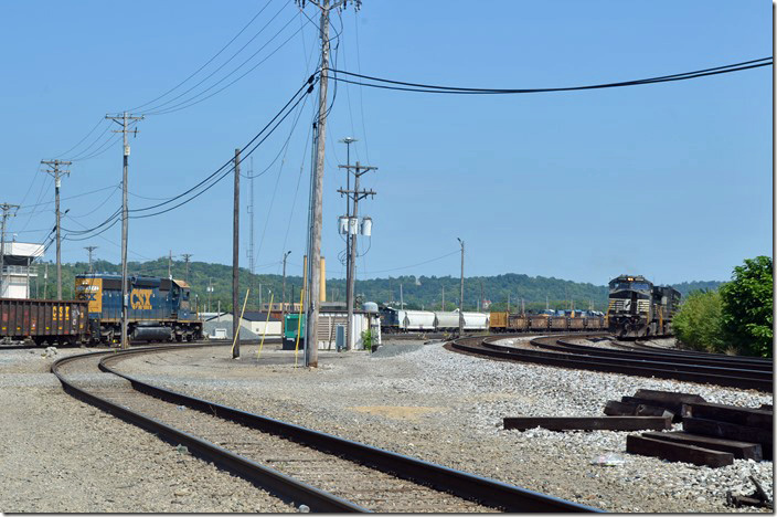 S/b NS freight behind 9487-9345. This train was mostly steel coil cars. Vacant CSX trim tower on the left. Queensgate OH.