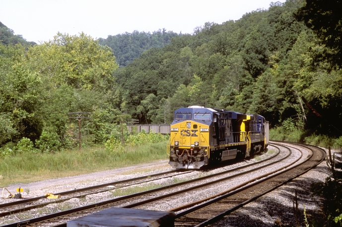 CSX 807-25 are parked in the siding without a crew. They will eventually take this SCWX (Santee-Cooper) train to Martin.