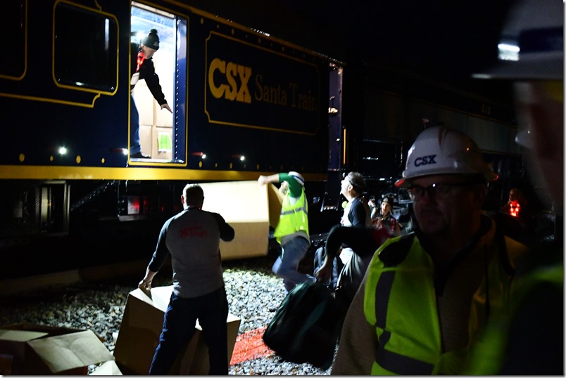 A side door was added to the new “Santa car” so boxes of gifts could be unloaded to volunteers on the ground. CSX Santa Train. Marrowbone KY.