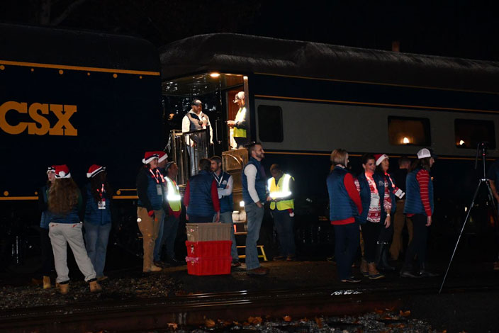 I headed for Shelby, the origin point. Santa is scheduled to depart at 0600, but there was a big crowd anyway. Totes of goodies were shuttled by Elves from the car to the crowd.