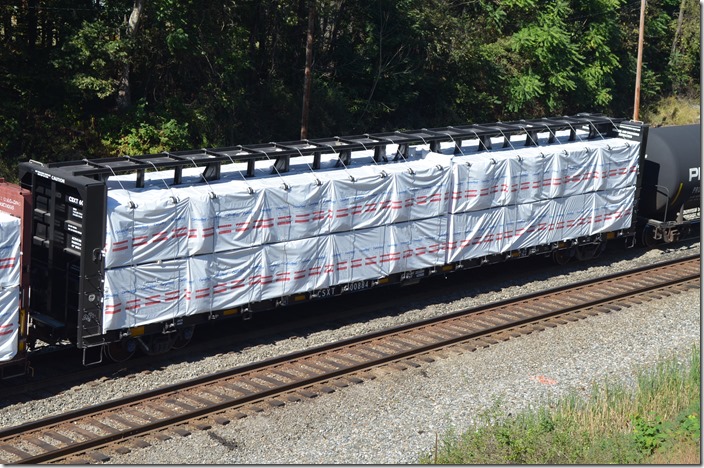 CSXT center beam flat 600884 loaded with lumber and the tie-downs in place. Load limit is 223,500 lbs. Never seen one of these with CSX marks at all! Mexico MD.