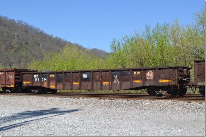 SBD MW gon 479784 was previously L&N 172008. Notice the “MW” markings on many of these cars to indicate they are now in non-revenue service. These 70-ton cars were also built by P-S at Bessemer AL in 1966. That plant is gone now. Shelby KY.