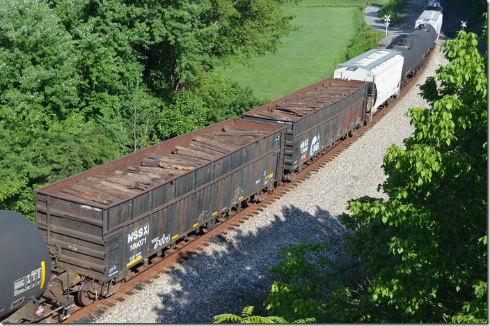 National Salvage & Service reclaims old ties and poles, demolishes industrial sites and scraps abandoned rail lines. NSSX gons 100071-100068. Bays Branch KY.