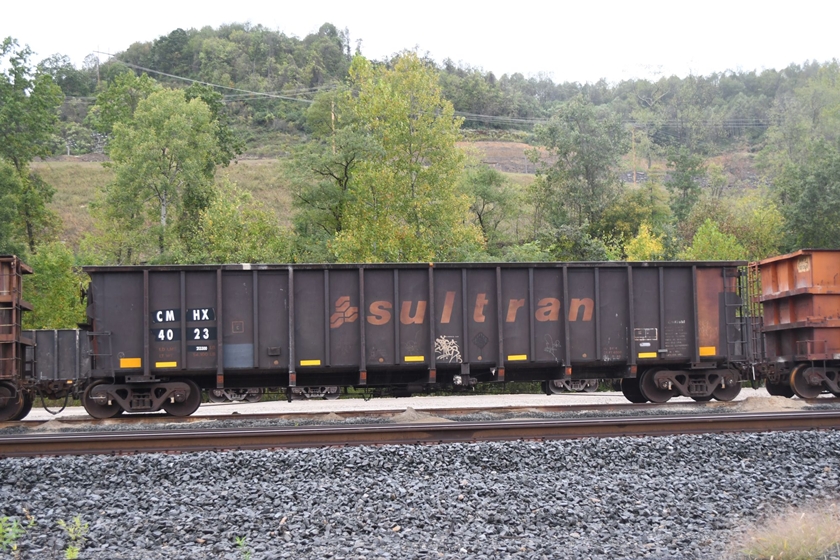 CMHX (Car Math Inc) 4023 waits empty at Prarie Transport in the NS, former Monongahela Ry., Maidsville (Morgantown) yard. 09-27-2024.