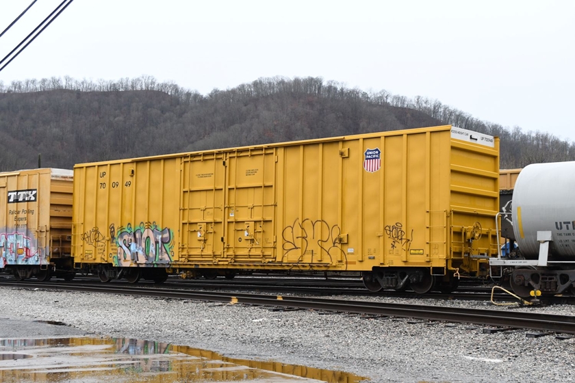 UP 700949 is leaving Shelby on westbound local L200 on 12-29-2024. CSX instituted L200 and L201 to handle Kingsport's chemical and paper traffic to Russell after the flooding south of Erwin in Sept. 2024. This Domtar paper business is contained mostly in Railbox cars, but there a few almost-new UP's in there. No. 700949 has 7,500 cubic feet of volume, 205,100 load limit and was built by TrinityRail on 10-2023.