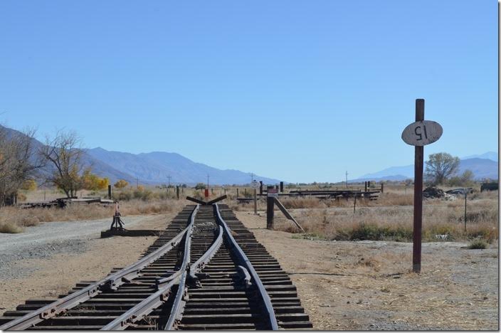 Looking south toward Keeler, Owenyo, etc. Actually in its last years of operation the bumper posts of the old C&C were at the north end of Laws. The narrow gauge was kept in operation at the end only from Owenyo to Laws, 71 desolate miles. SP end of track looking south. Laws CA.