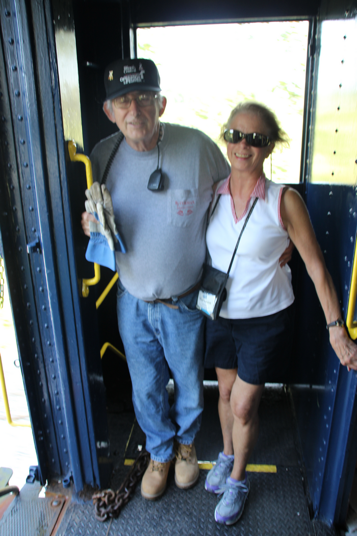 The well-dressed Conductor and his wife.