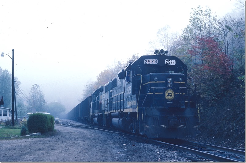 Can’t tell if Hazard No. 2 is loading at Arnold or just waiting for the No. 8 to get on down the line ahead of him. Looks like unit train hoppers. Arnold was the only tipple on Jake’s Fork that loaded unit trains to my knowledge. L&N Lotts Creek.