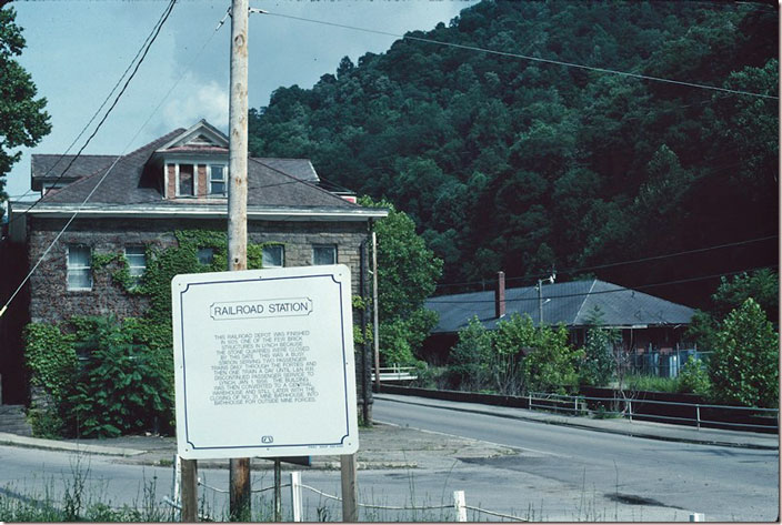 The office building/wash room is on the left and the L&N depot is in the background. Lynch Railroad Station.