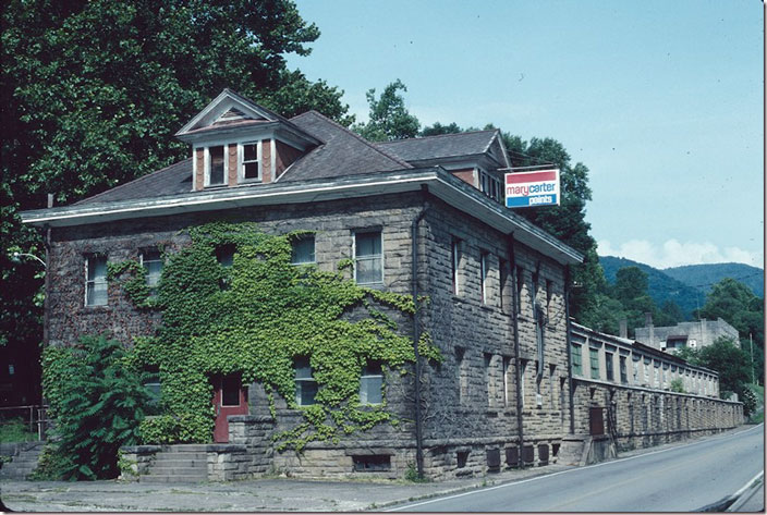 Office building with bath house attached. The post office, bank, and other executive offices were in the building on the right in the distance. Lynch. 07-17-1994.