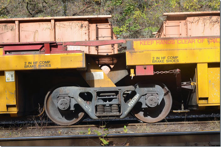 The Komatsu back hoe can move from one car to another by using this red steel bridge. HZGX link.